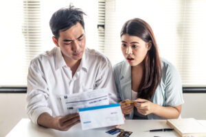 Man and woman try to find money to pay credit card debt and all loan bills. Financial problem from coronavirus or covid-19