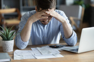 Man stressed because of debt