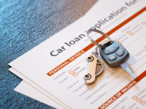 Car loan application with car keys - Prudent Financial Solutions