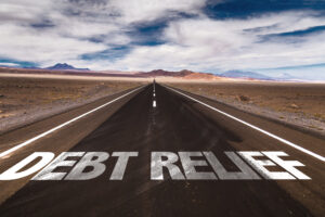 Debt Relief written on desert road - Prudent Financial Solutions