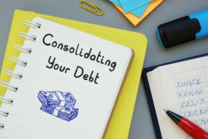 consolidating your debt written on a notebook